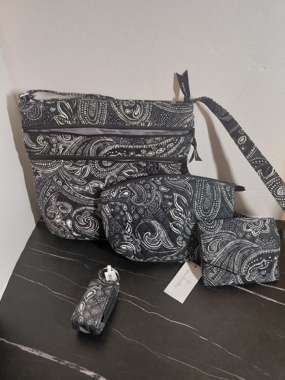 Vera Bradley multi-piece bag and wallet set features the retired black-and-white